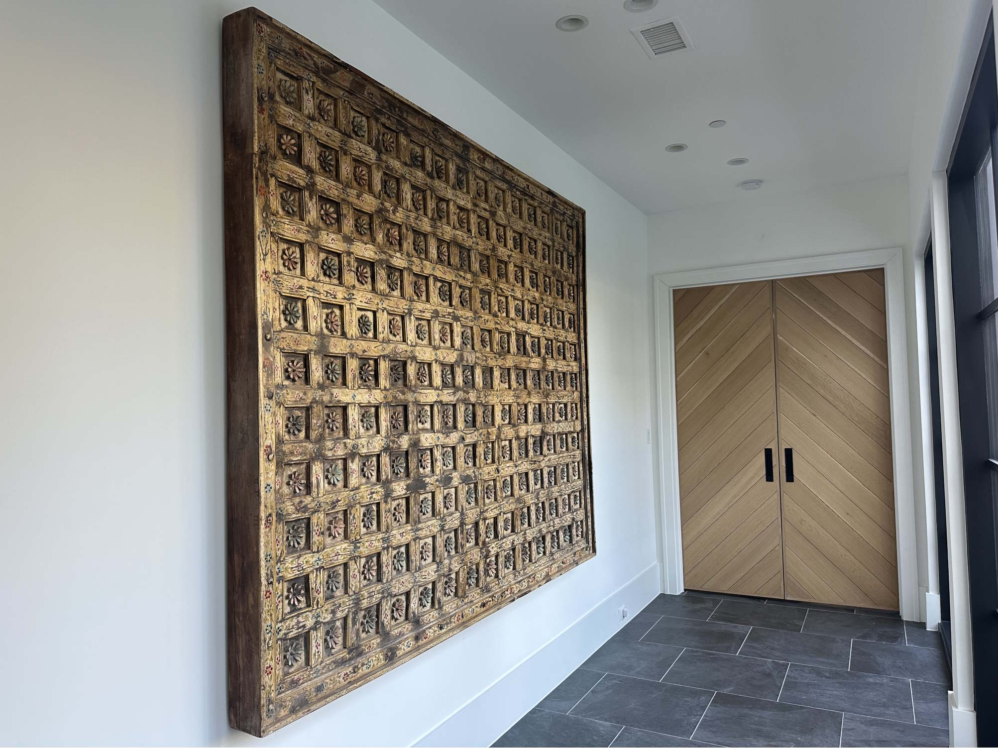 Carved ceiling panel in a room designed by Jean Liu Designs