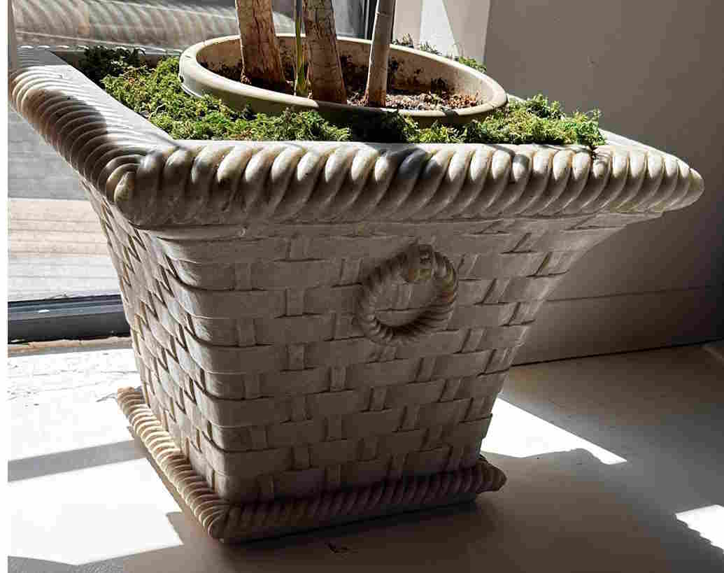 Marble planter hand-carved as a woven basket with a rope-twist rim.