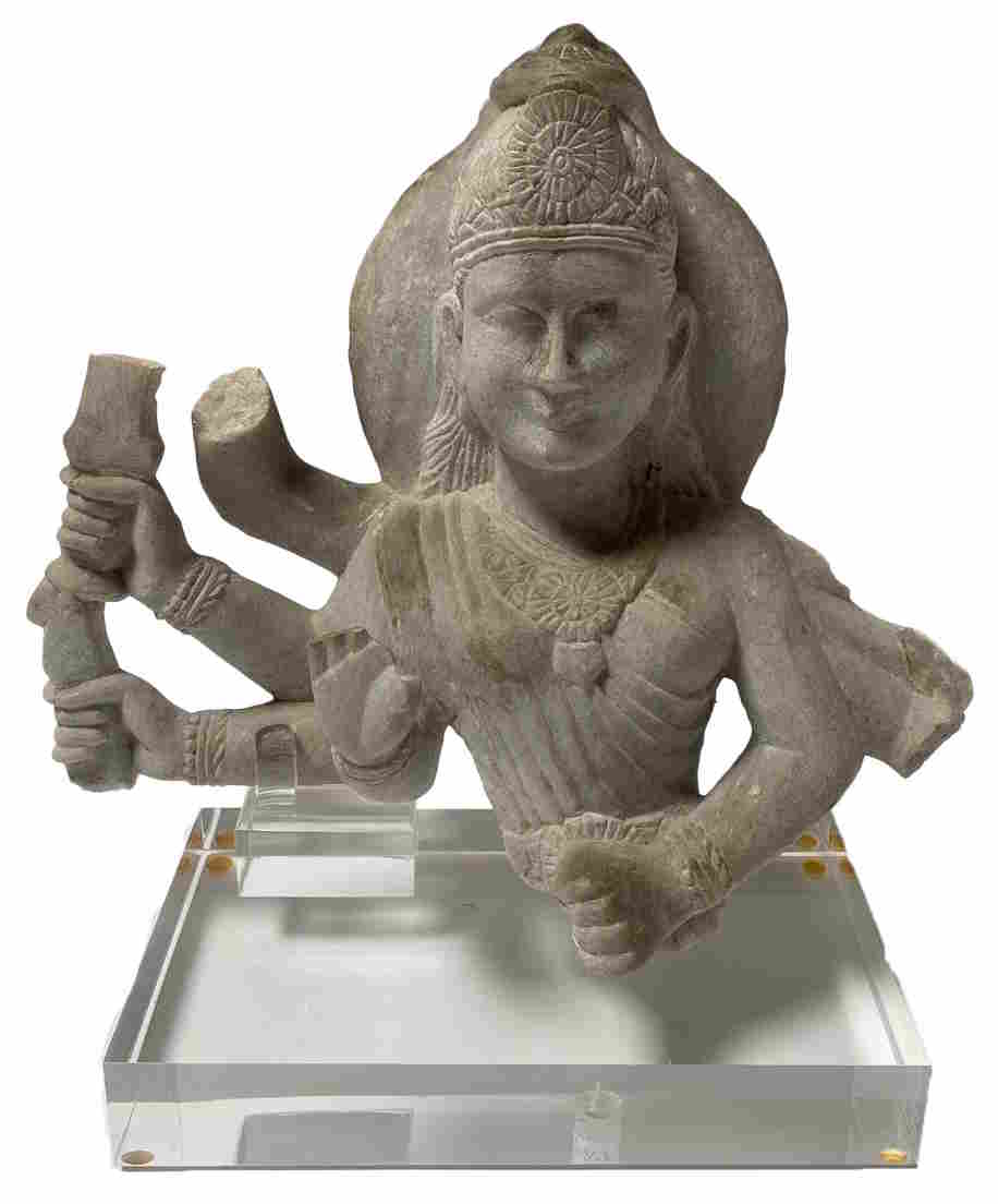 Hand-carved marble figure of a multi-armed deity on a clear acrylic base.