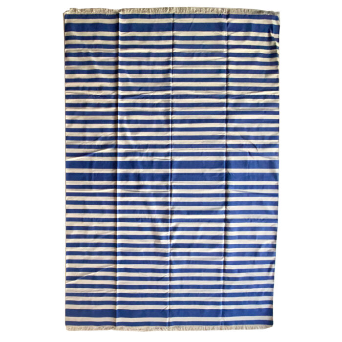 A blue and white striped rug from the Dallas store AOI Home.