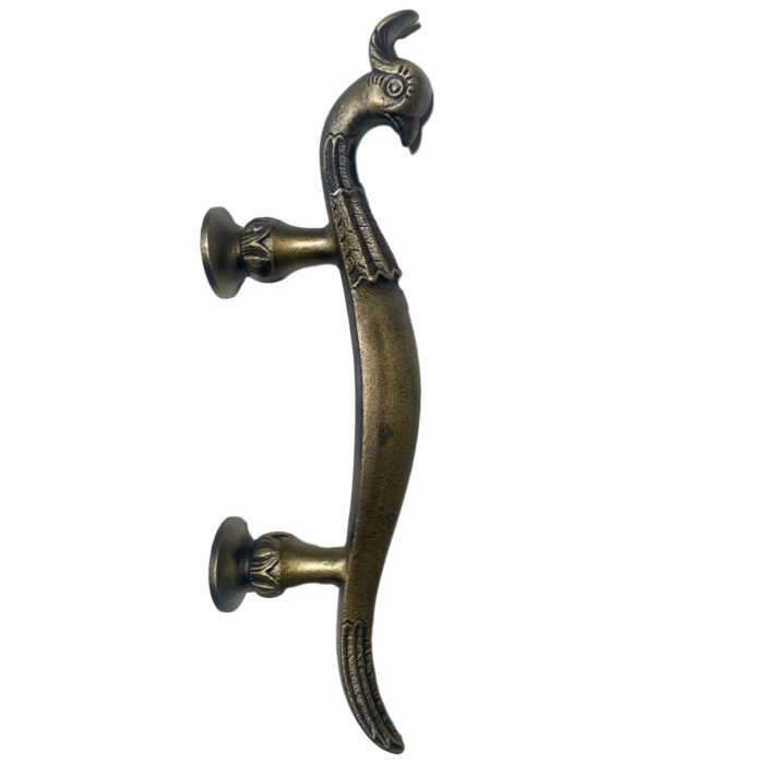 A unique brass handle shaped like a peacock from the Dallas design store AOI Home.