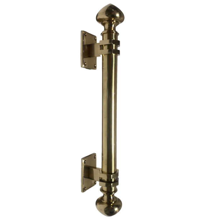 A large statement brass door handle from the design showroom AOI Home.