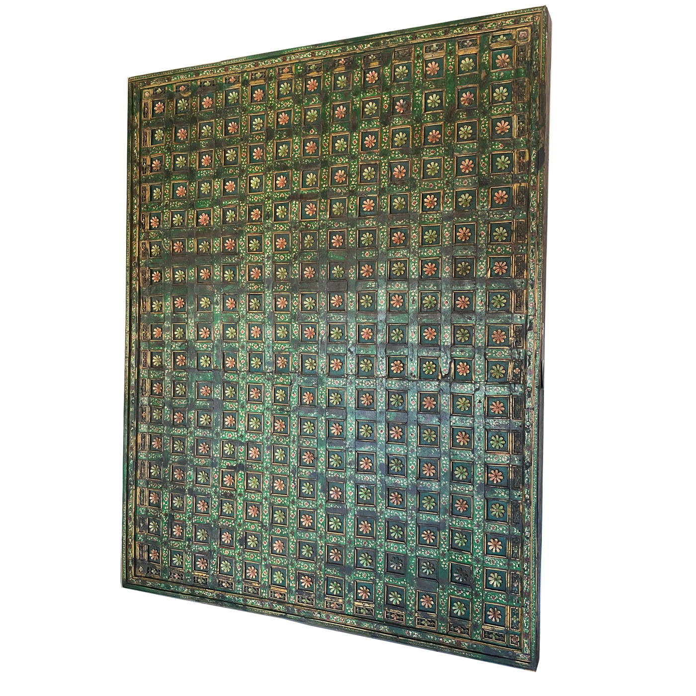 A hand-carved antique ceiling panel with green and gold flowers from AOI Home.