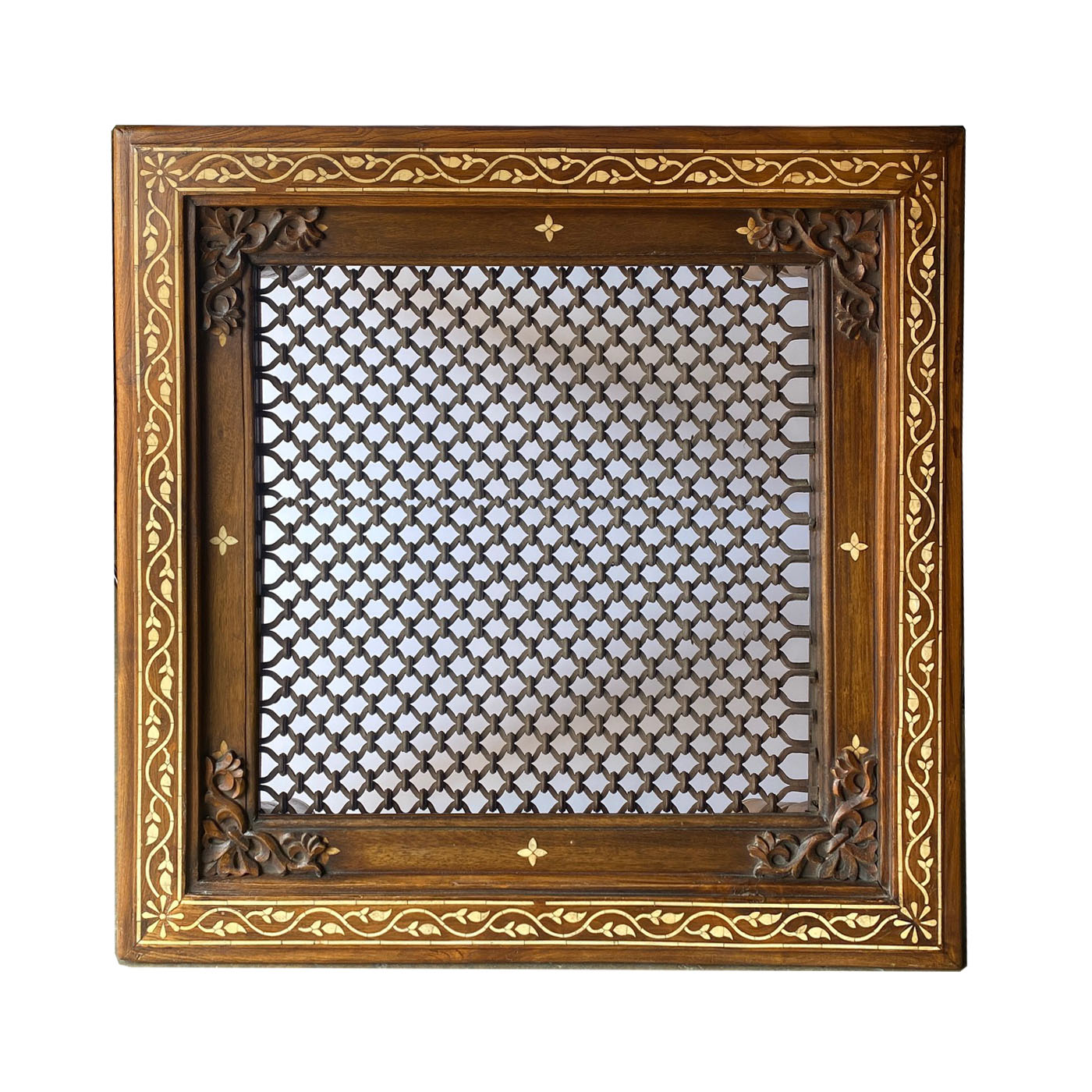 A square bone inlay and iron grill coffee table from the interior designer favorite shop AOI Home.