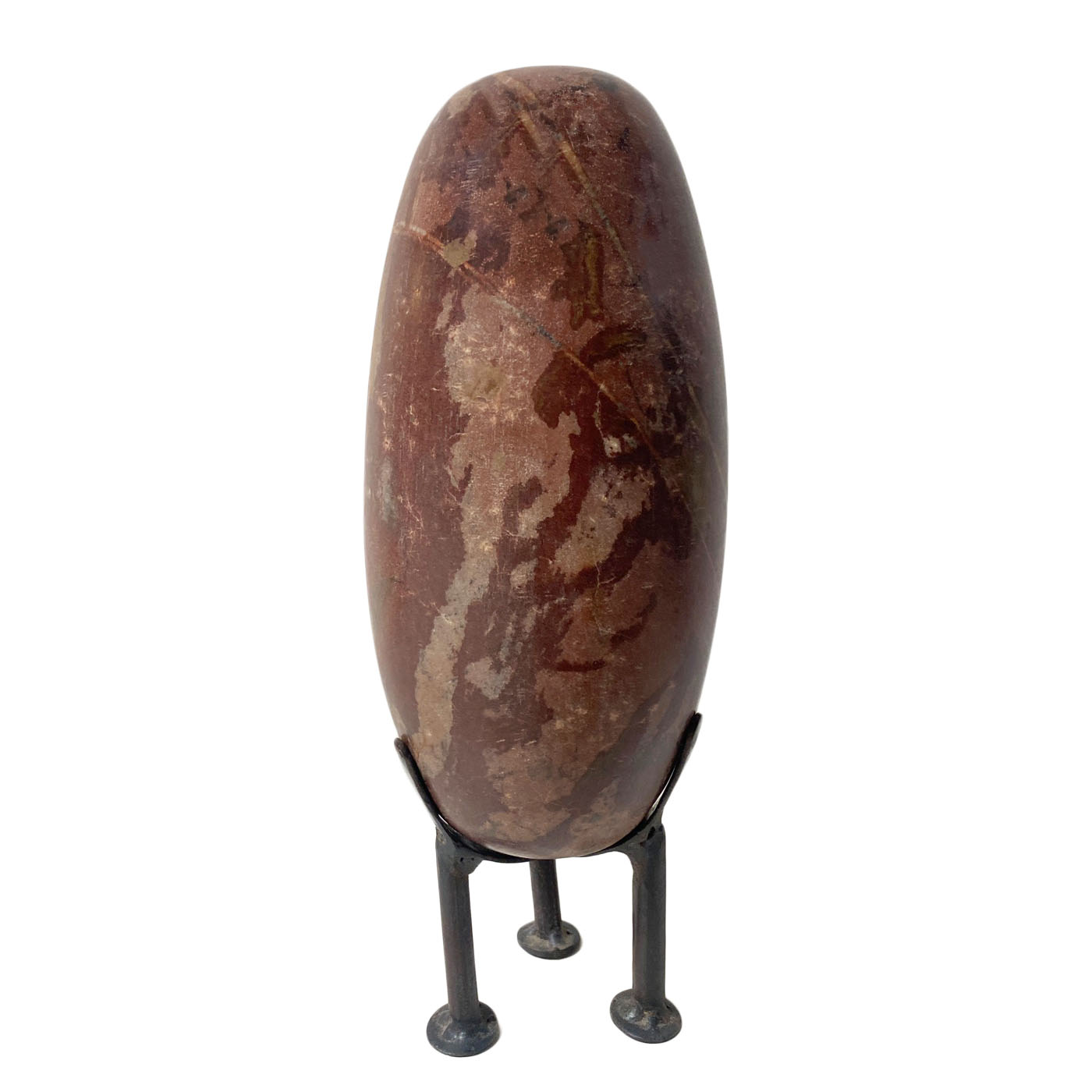 Hand-carved solid stone egg-shaped sculpture on iron stand.