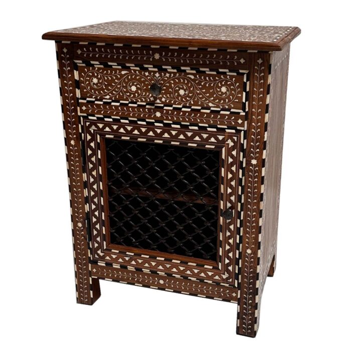 Teak side table with cream bone inlay patterns, one drawer, and a cabinet door with dark iron lattice panel.