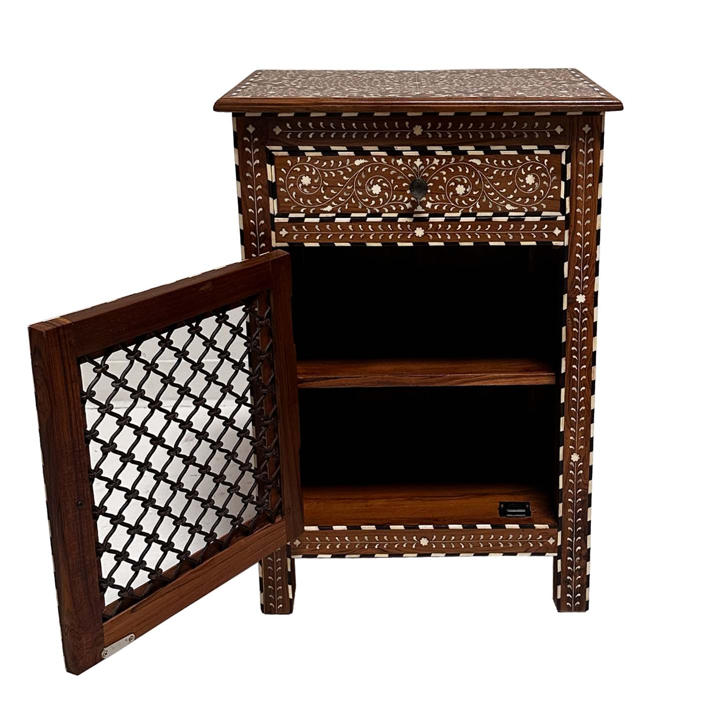 Teak side table with cream bone inlay patterns, one drawer, and a cabinet door with dark iron lattice panel.
