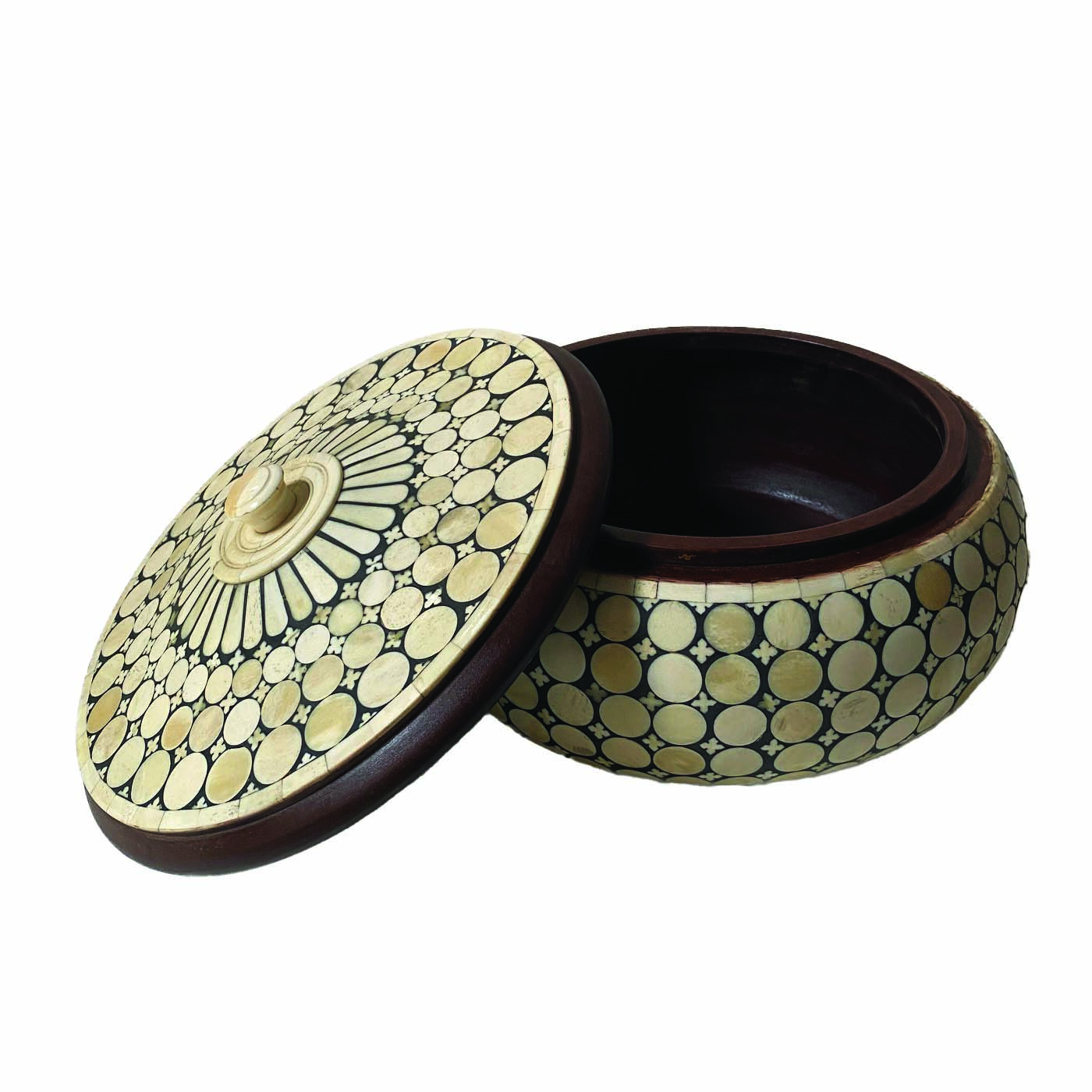A round bone inlay box with a removable lid and a dot pattern.